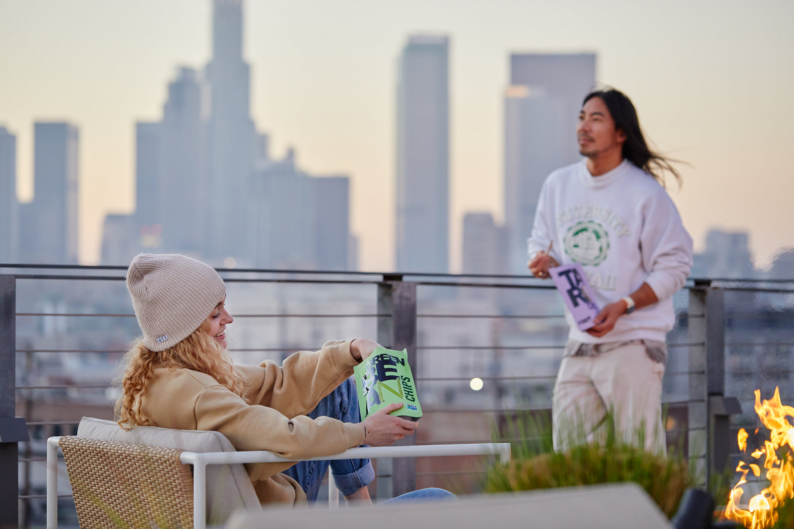two friends on a rooftop enjoying Root Foods chips